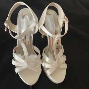 Slightly off white satin t-strap platform heels. Never worn, size 37=6.5US